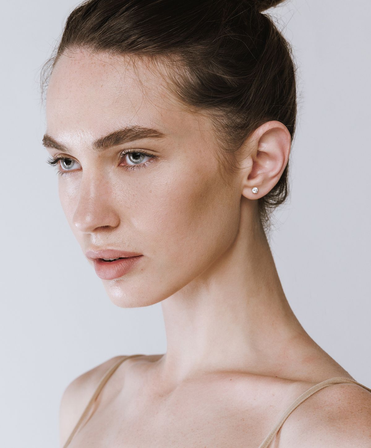 Profile of a young woman with natural makeup.