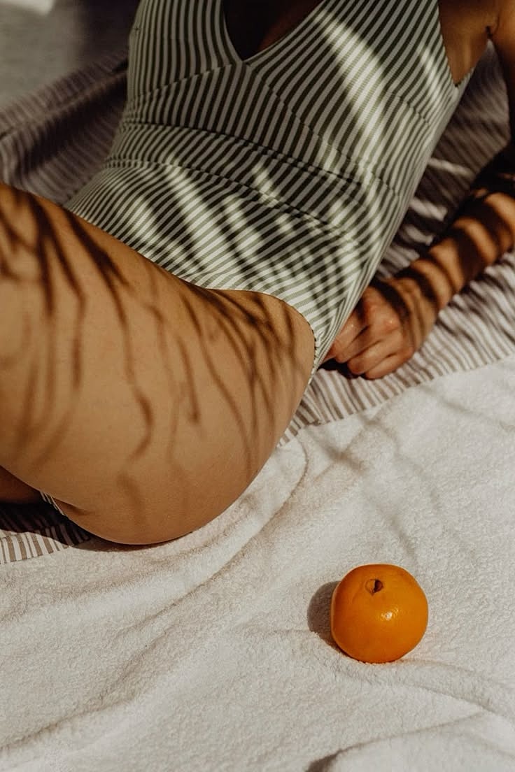 Model in black outfit with wavy hair