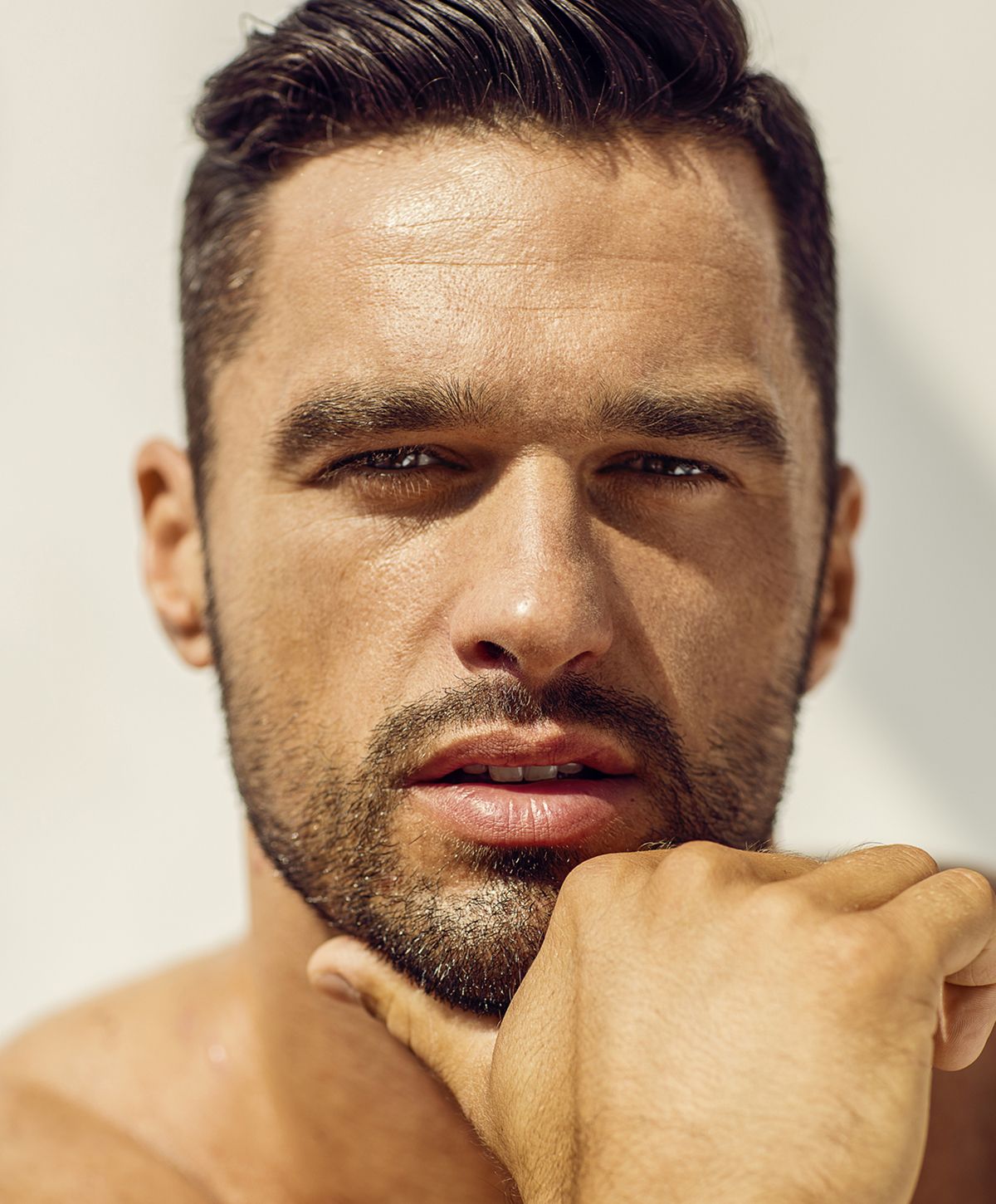 Close-up portrait of a man with stylish hairstyle.