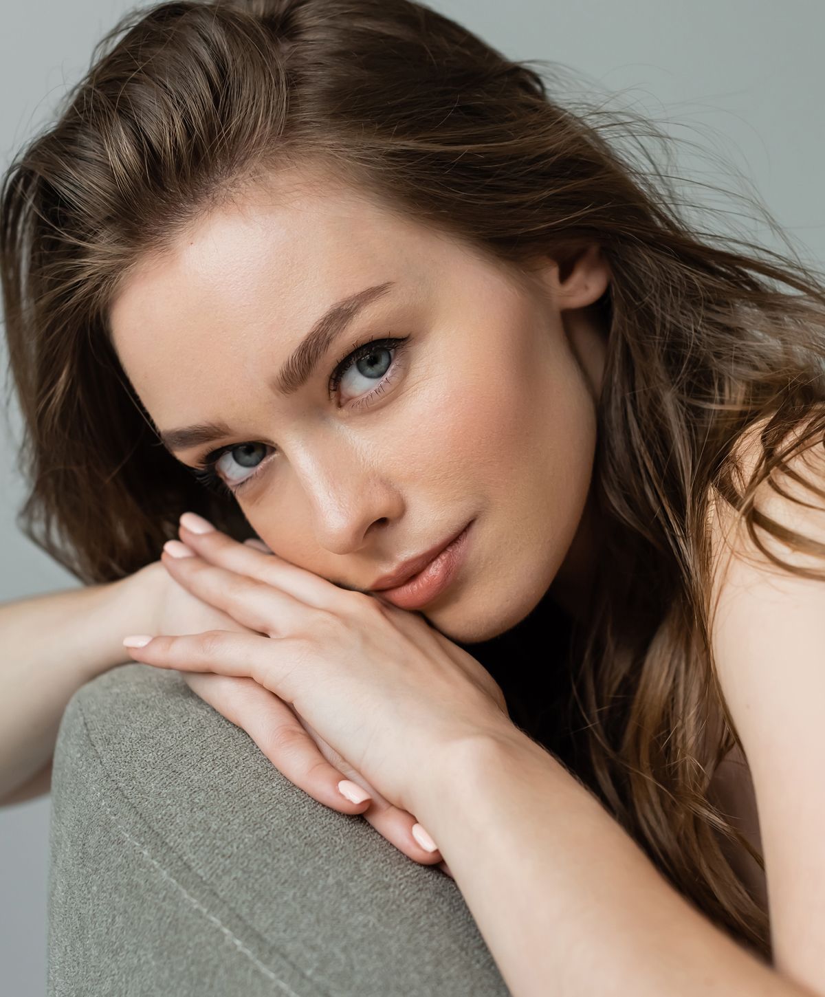 Woman with closed eyes and soft expression.