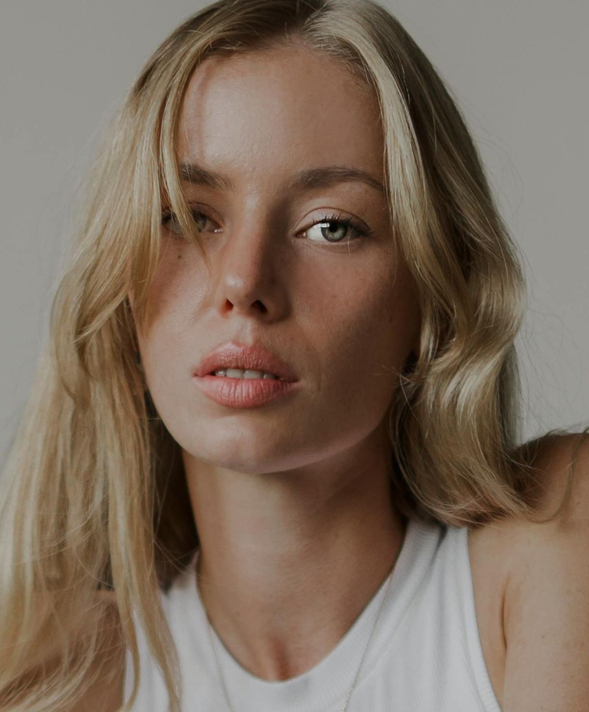 Portrait of a woman with blonde hair.