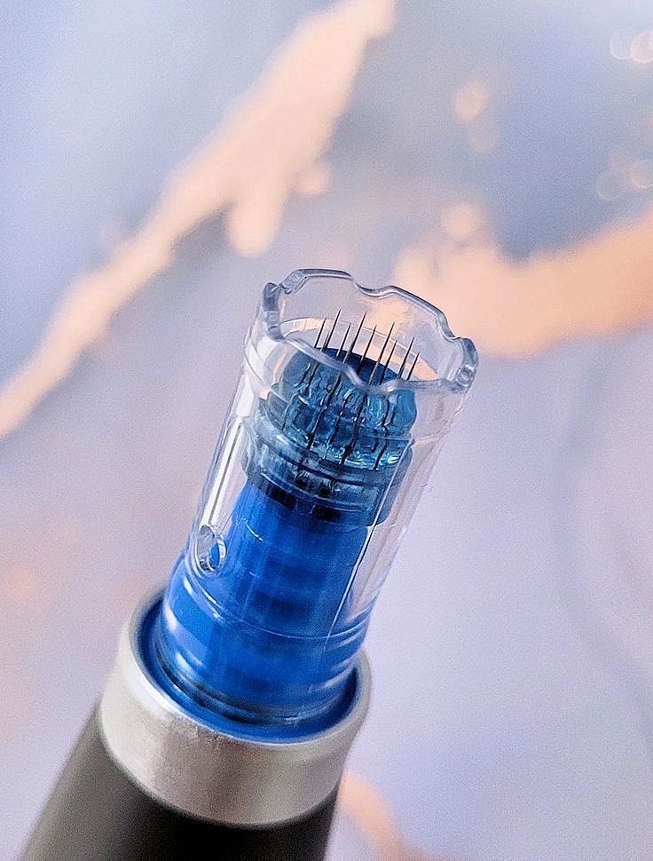 Close-up of a young woman in thoughtful pose.