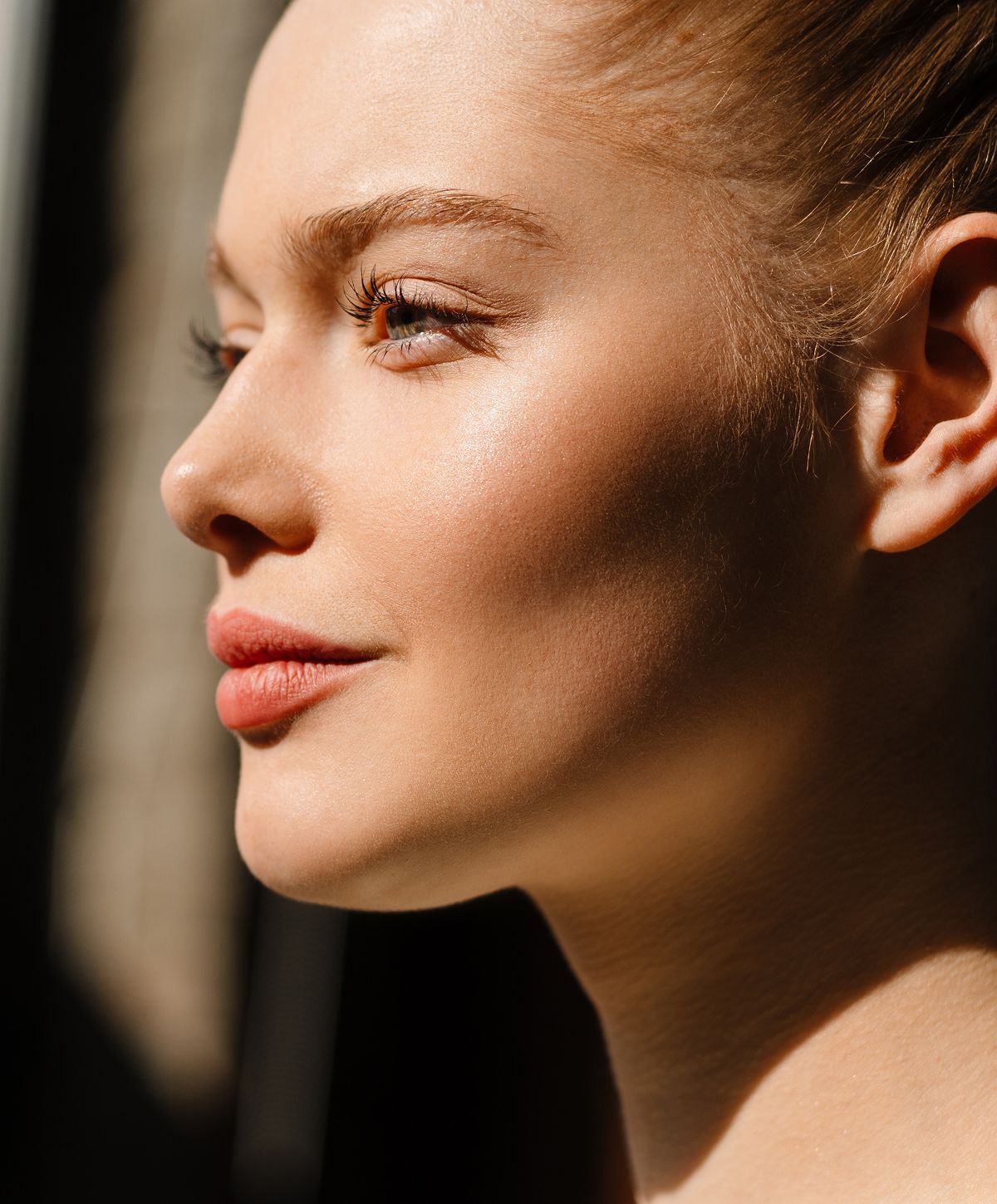Woman with long, wavy hair and soft features.