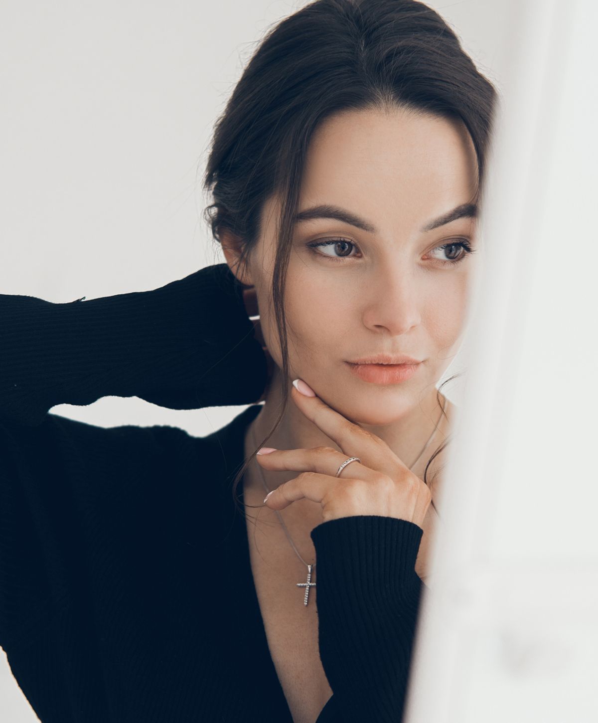 Woman with red hair and soft expression.
