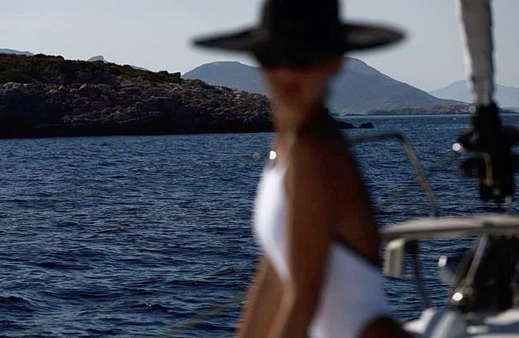 Blurred figure by the sea in a swimsuit.