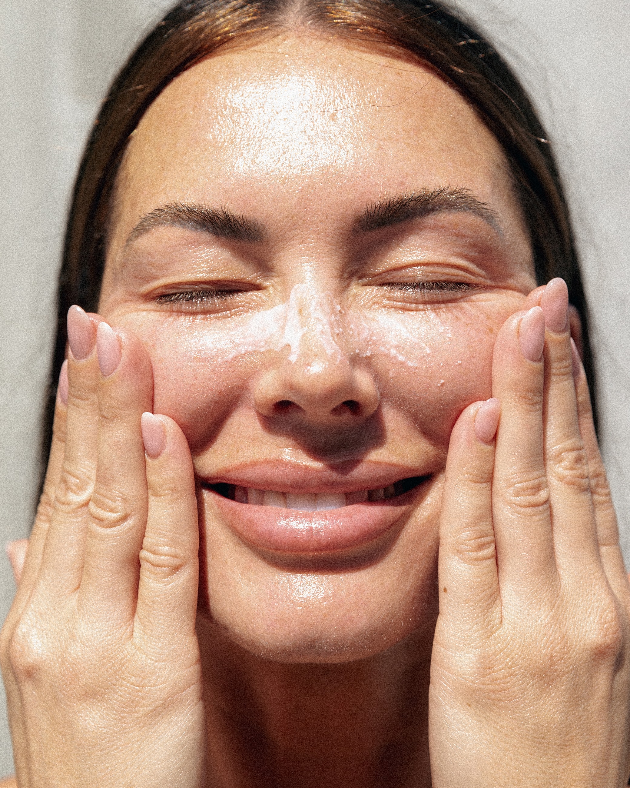 Woman with soft features and flowing hair.
