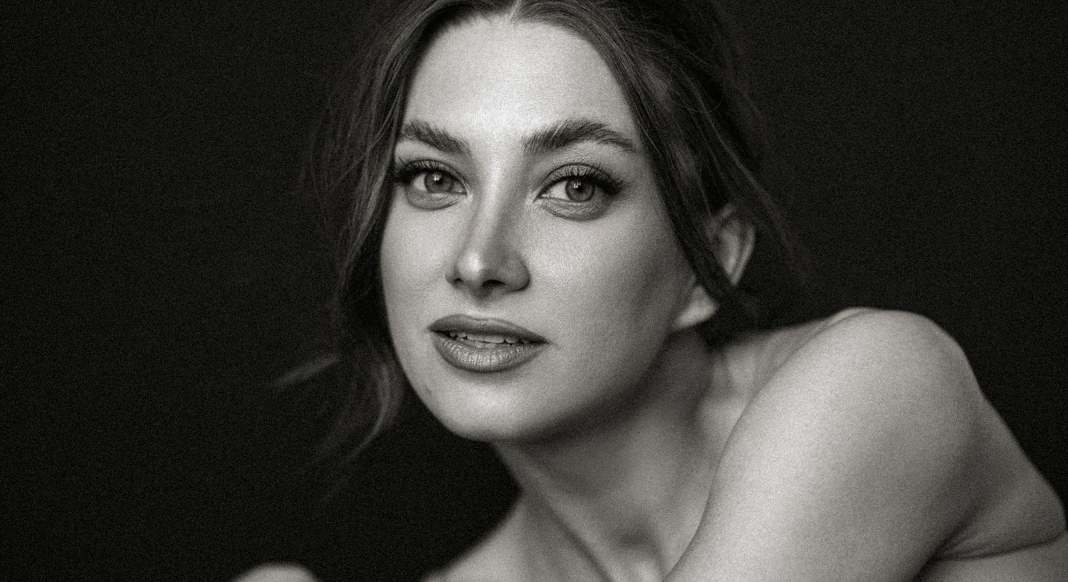 Black and white close-up portrait of a woman.